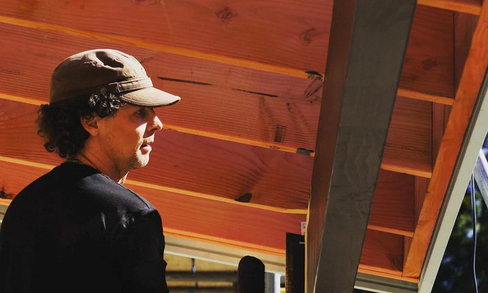 Hawea Grove's Keith Stubbs looks at the roof of his partially built home. 